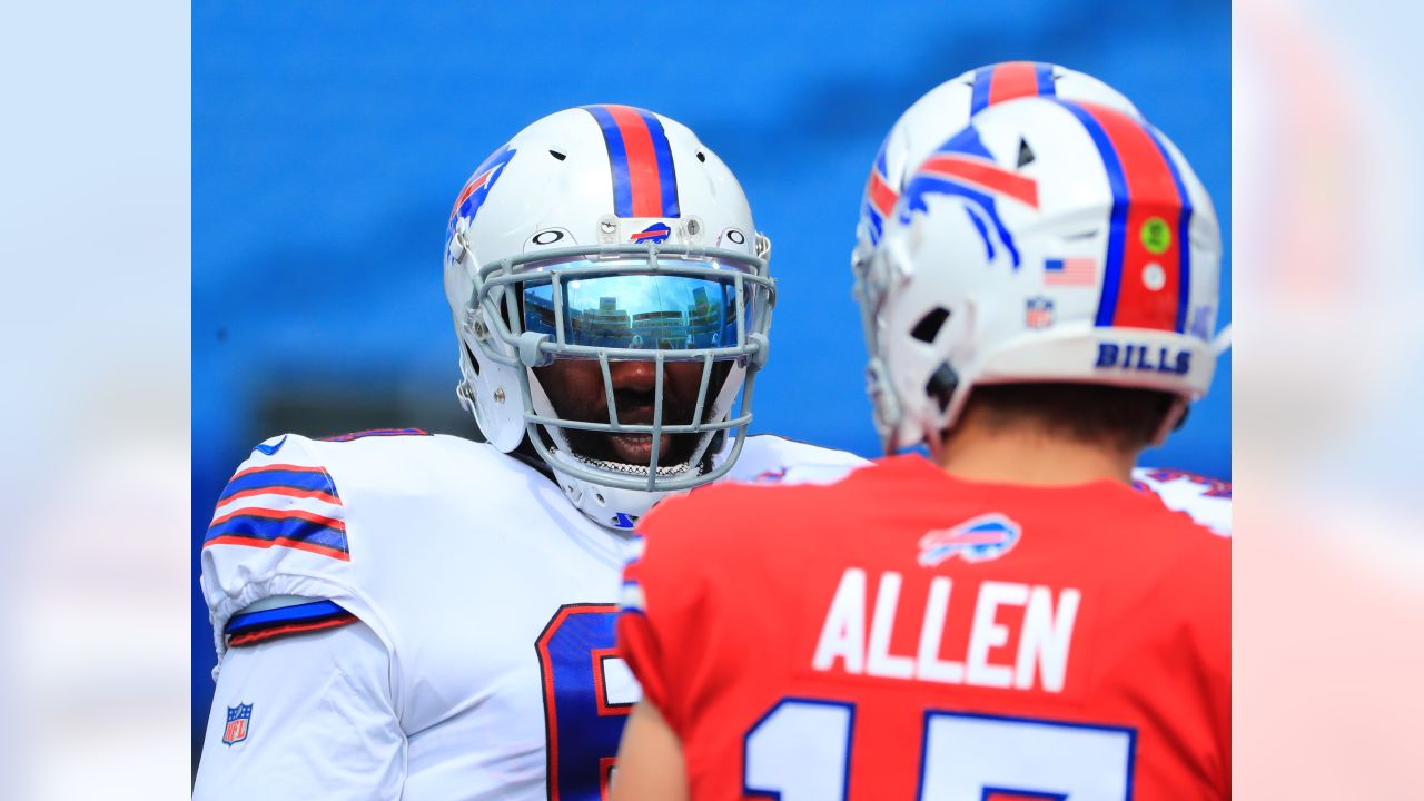 Buffalo Bills quarterback Josh Allen (17) hands off the ball to running  back Devin Singletary (26) during the first quarterof an NFL division round  football game, Sunday, Jan. 22, 2023, in Orchard