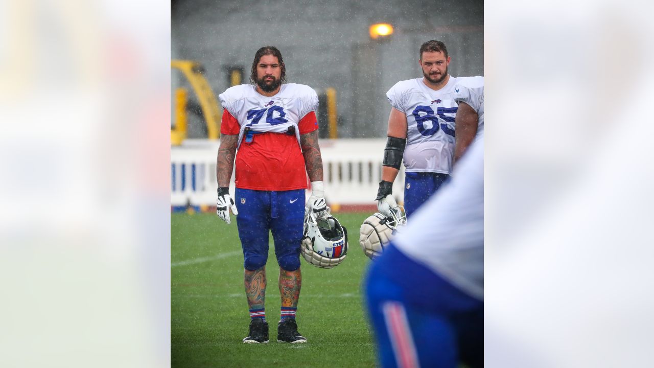 Buffalo Bills offensive lineman Dion Dawkins (73) sprays his face with  water during practice at the NFL football team's training camp in  Pittsford, N.Y., Monday July 25, 2022. (AP Photo/Joshua Bessex Stock