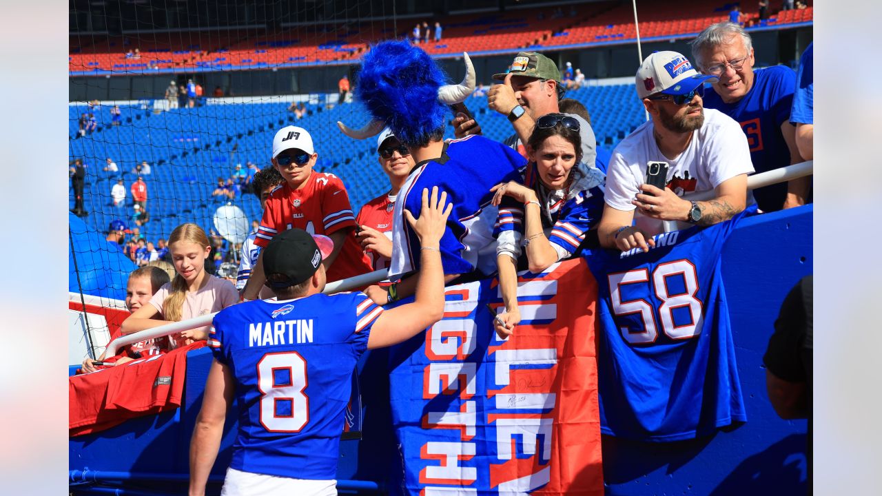 Buffalo Bills vs. Miami Dolphins. Fans support on NFL Game. Silhouette of  supporters, big screen with two rivals in background Stock Photo - Alamy