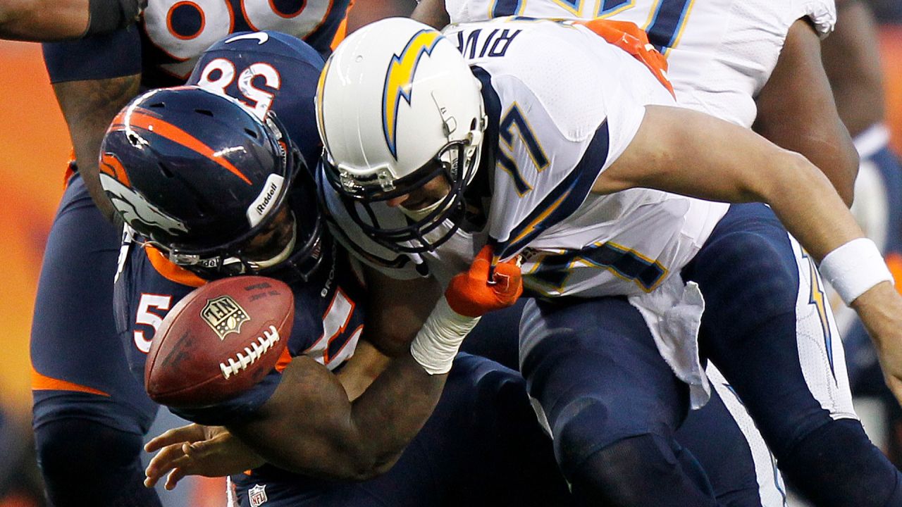 Photo: Broncos QB Peyton Manning sacked for nine yard loss by