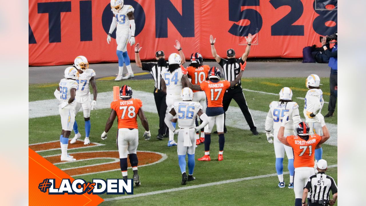 Denver, Colorado, USA. 1st Dec, 2019. Broncos RB PHILLIP LINDSAY starts to  take off his jersey to exchange with a Chargers player during the end of  the game at Empower Field At