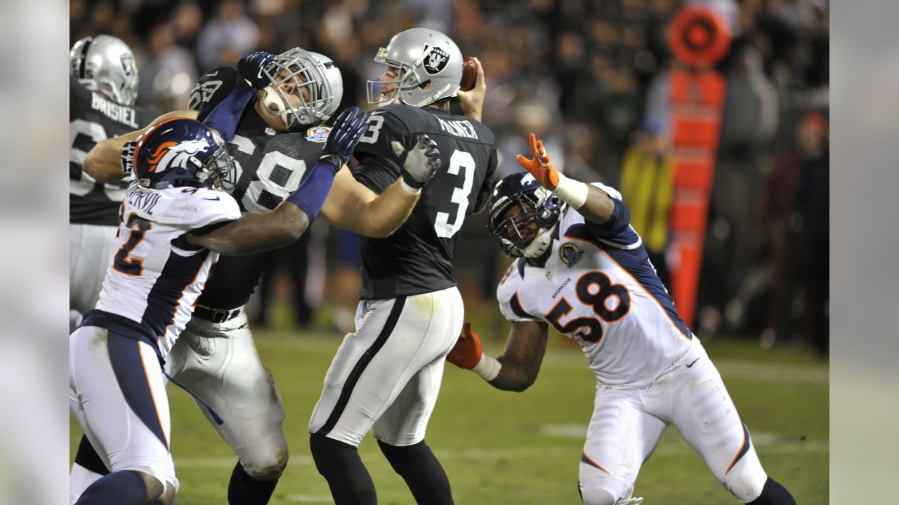 Denver Broncos outside linebacker Von Miller (58) reacts to a play against  the Las Vegas Raiders in the first half of an NFL football game Sunday,  Oct. 17, 2021, in Denver. (AP