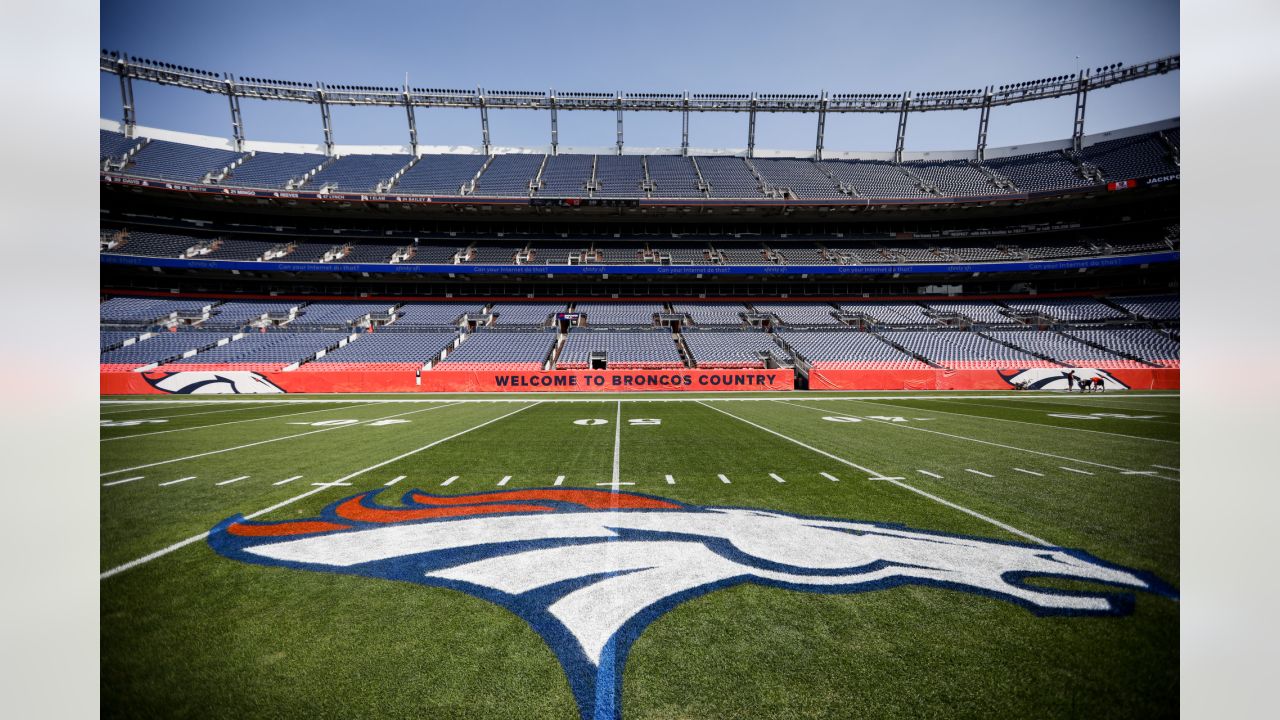 Painting a Broncos Hall of Fame wall at the Empower Field on the Team store.  2 more to go : r/Denver