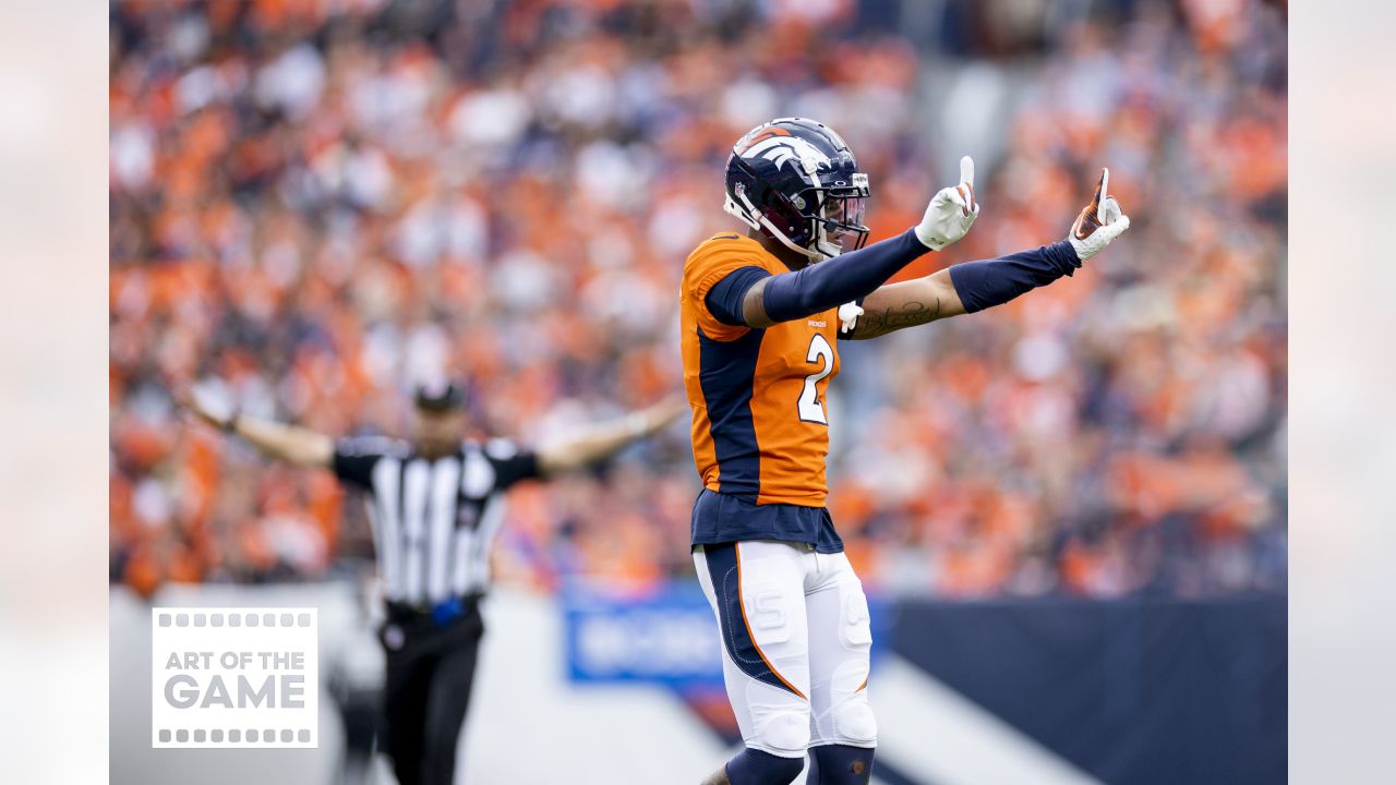 A Seattle Seahawks fan wearing a Russell Wilson jersey waves a towel next  to a Denver Broncos fan wearing a Russell Wilson jersey before an NFL  football game, Monday, Sept. 12, 2022