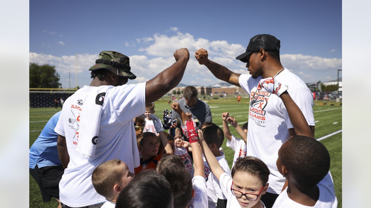 Javonte Williams, Pat Surtain II help inspire next generation at youth  football camp