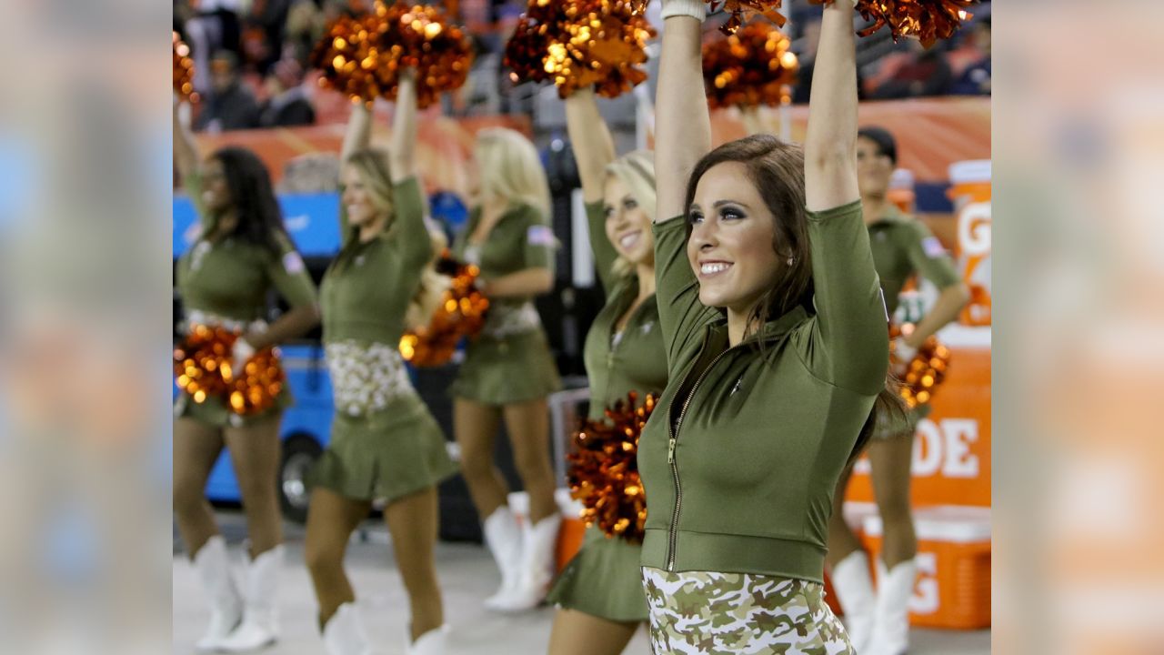 The Denver Broncos cheerleaders wear green to celebrate the NFL's Salute to  Service prior to an NFL football game against the New England Patriots,  Sunday, Nov. 12, 2017, in Denver. (AP Photo/David