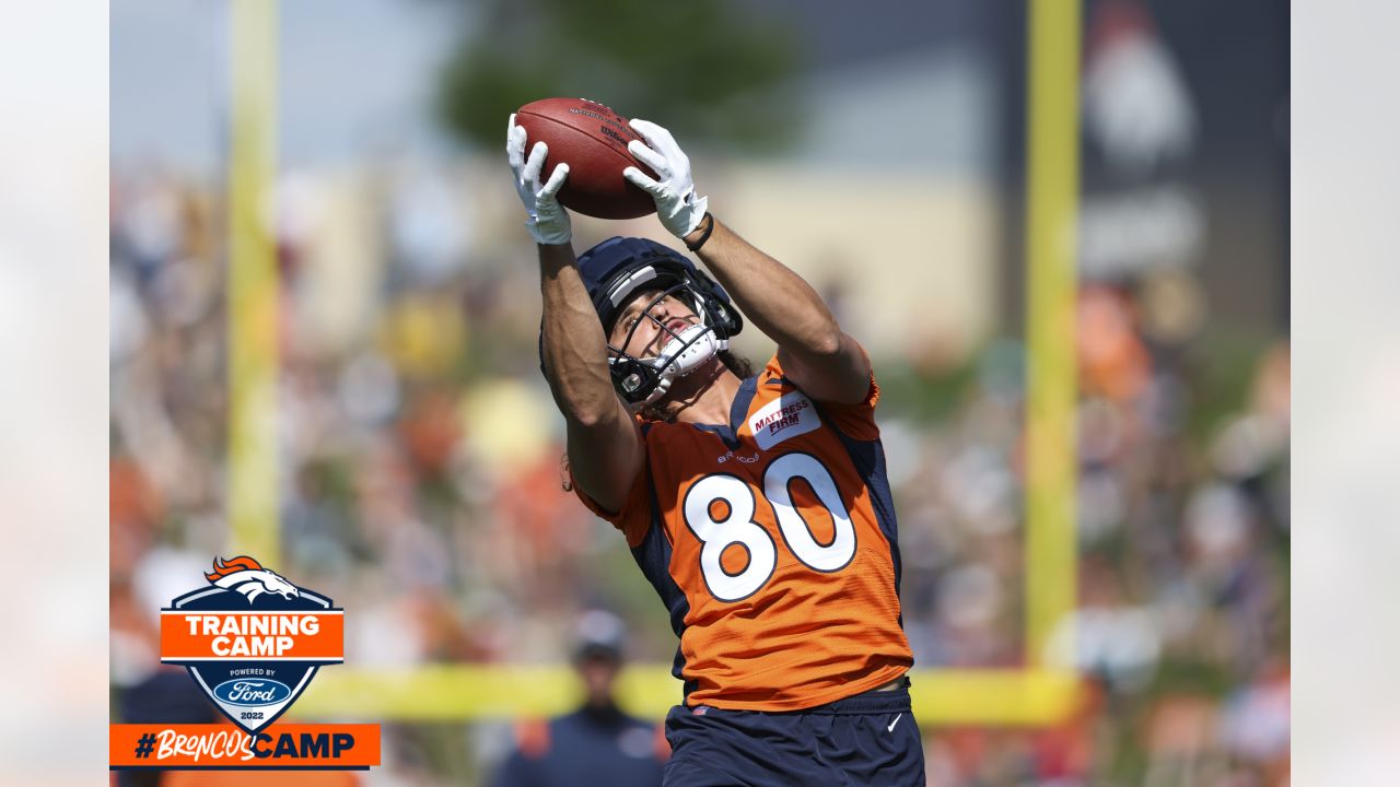 Denver Broncos tight end Greg Dulcich (80) takes part in drills