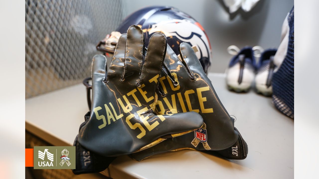 A U.S. Marine wears Salute to Service gloves before an NFL