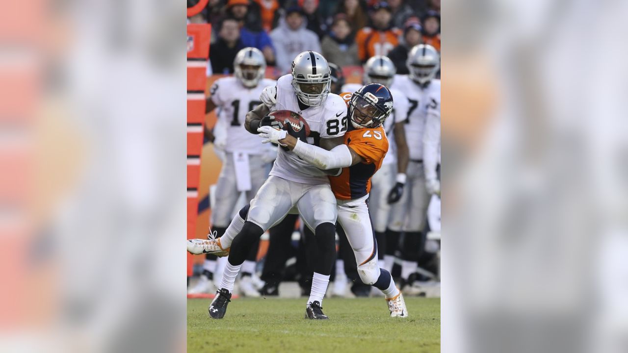 Denver Broncos DeMarcus Ware (94) and Malik Jackson wrap up