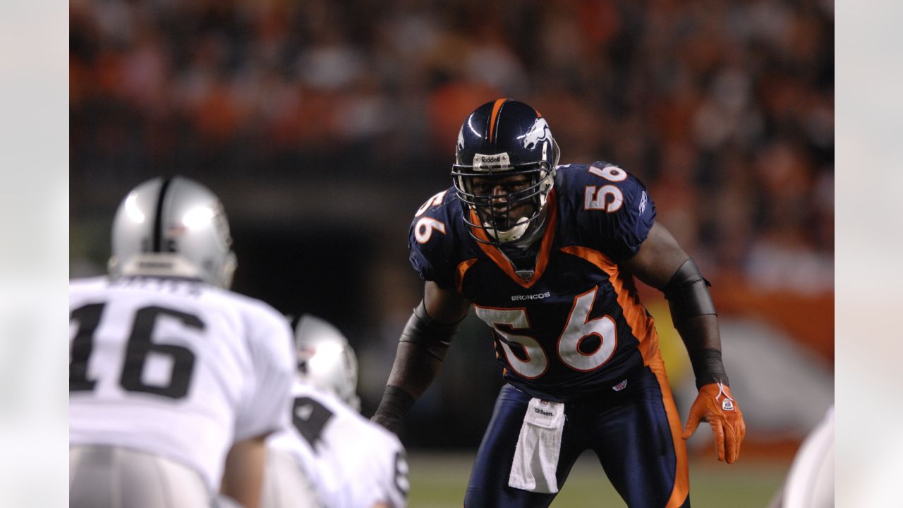 Denver Broncos wide receiver Emmanuel Sanders (10) catches a pass against  Houston Texans safety Kendrick Lewis during the first quarter at Sports  Authority Field at Mile High on August 23, 2014 in