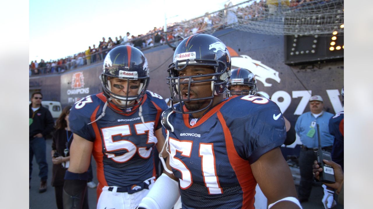 Denver Broncos linebacker Bill Romanowski celebrates after