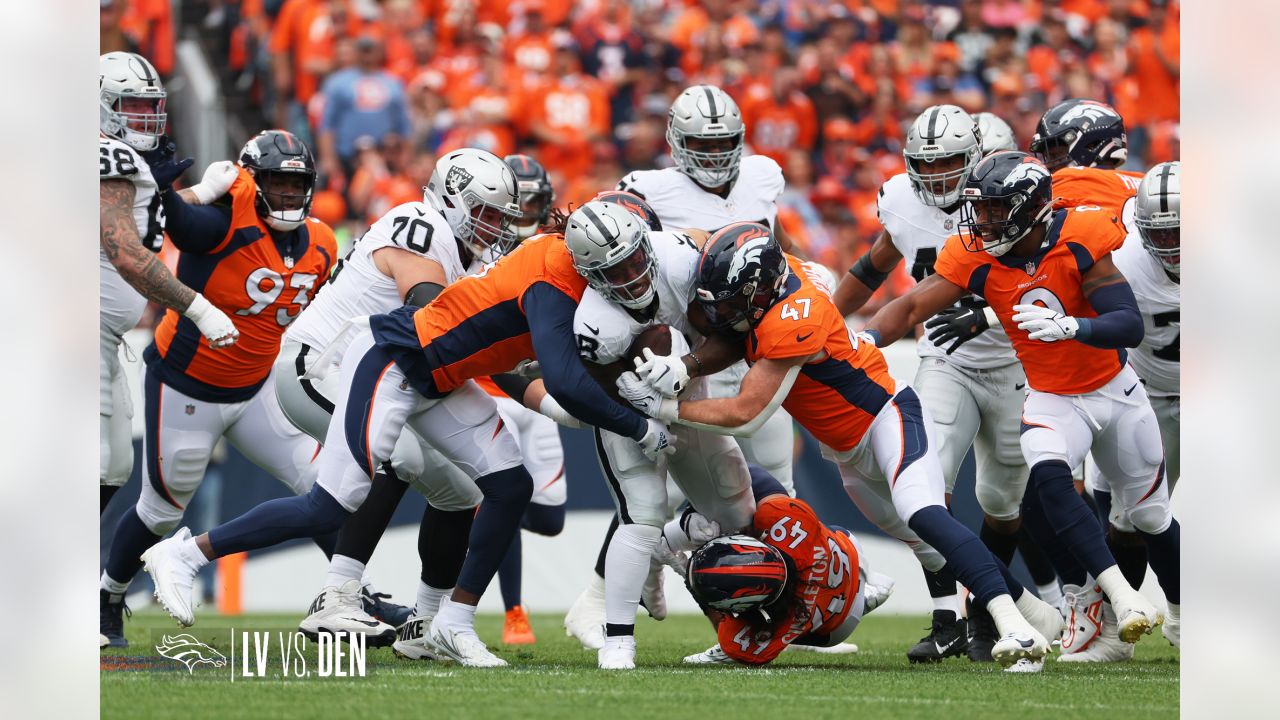 Denver Broncos vs. Las Vegas Raiders. NFL Game. American Football League  match. Silhouette of professional player celebrate touch down. Screen in  back Stock Photo - Alamy