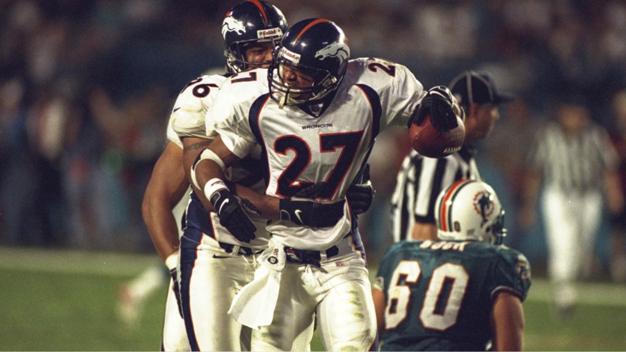 25 JAN 1998: Steve Atwater (27) of the Denver Broncos hits and knocks the  ball loose