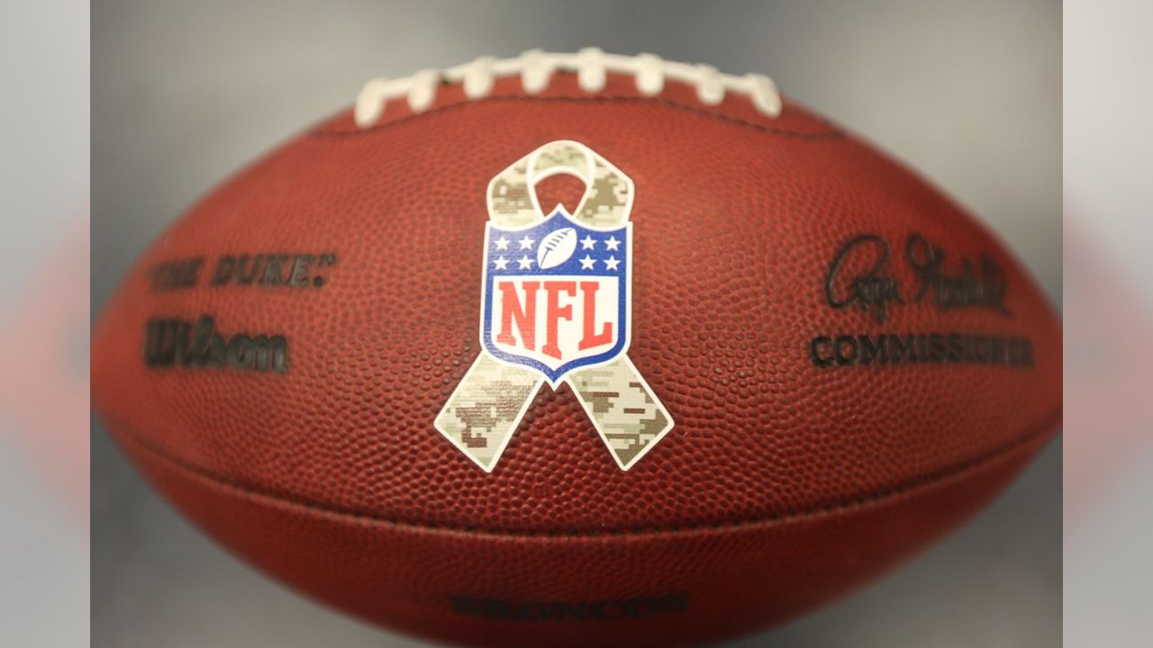 A Salute to Service towel is shown before an NFL football game