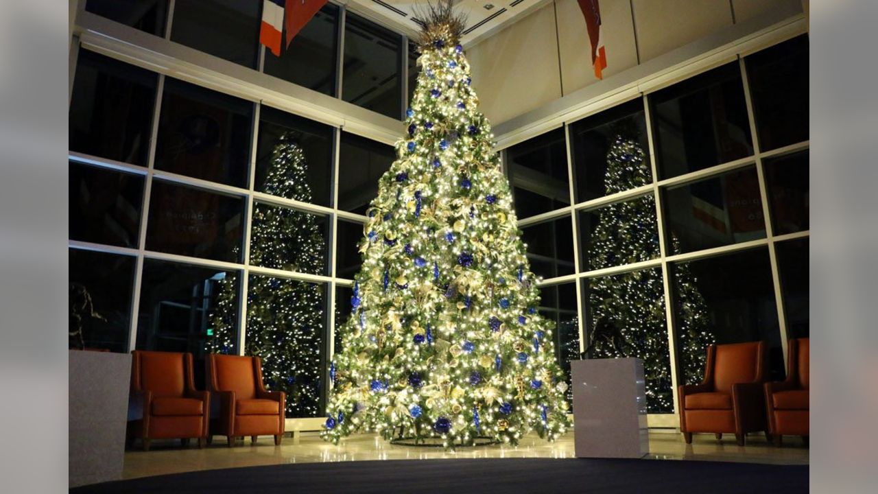 A Denver Broncos Christmas tree is set up as fans tailgate prior