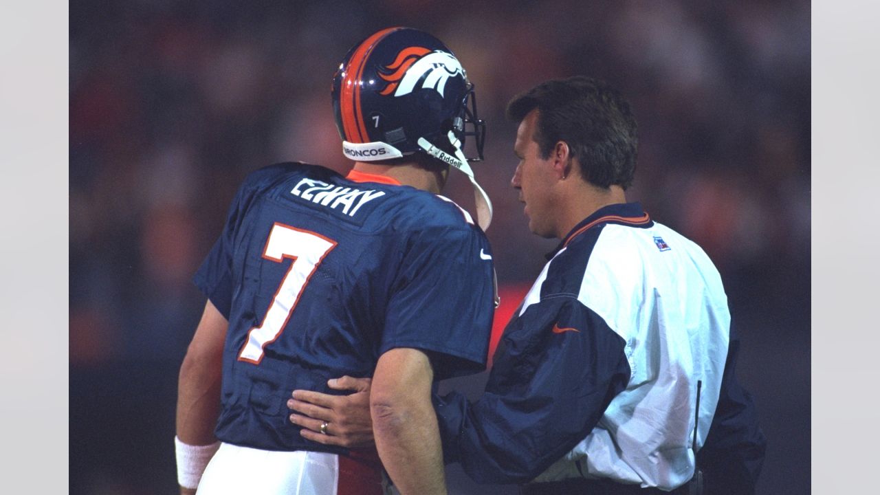 Quarterbacks JOHN ELWAY (7) and GARY KUBIAK (8) with defensive