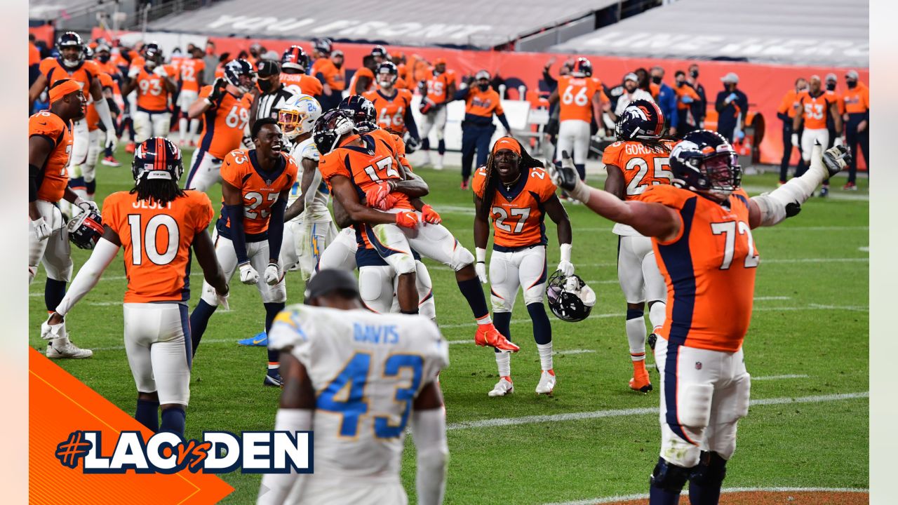 Denver, Colorado, USA. 1st Dec, 2019. Broncos RB PHILLIP LINDSAY starts to  take off his jersey to exchange with a Chargers player during the end of  the game at Empower Field At