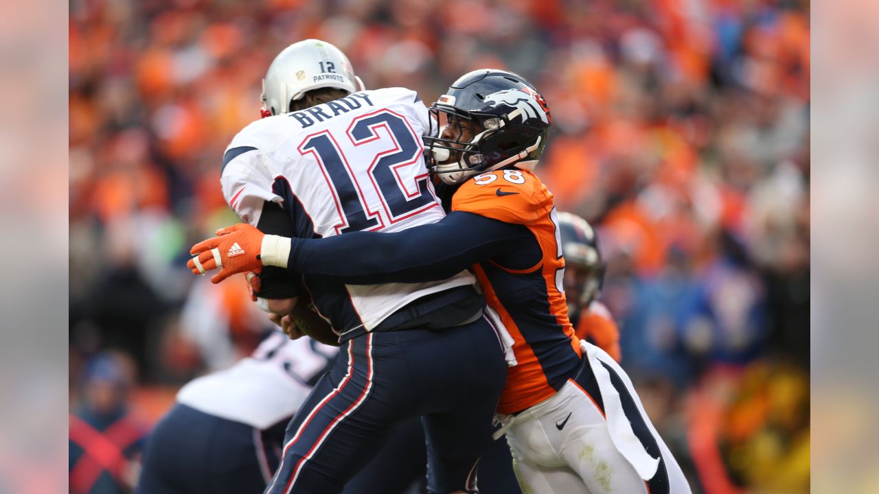 Kansas City Chiefs running back Kareem Hunt (27) gives a stiff arm to New  England Patriots defensive back Devin McCourty (32) as he runs for yardage  during the first half of an