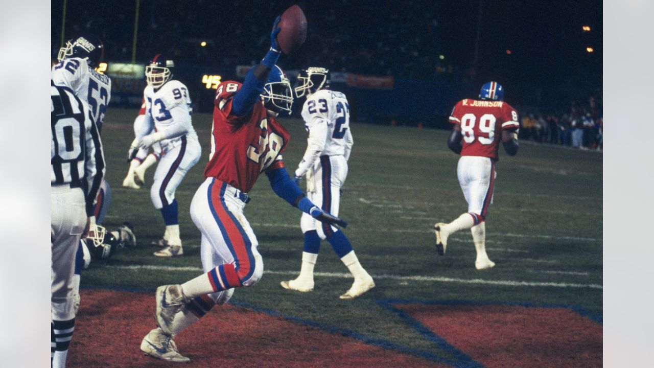 Running back Willis McGahee (23) runs upfield during an NFL game against  the New England Patriots – Denver Broncos History