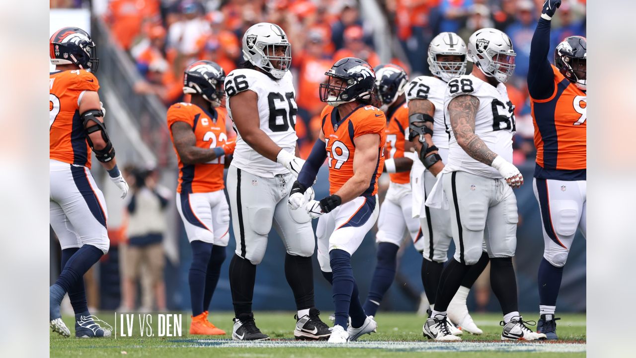 Denver Broncos vs. Las Vegas Raiders. NFL Game. American Football League  match. Silhouette of professional player celebrate touch down. Screen in  back Stock Photo - Alamy