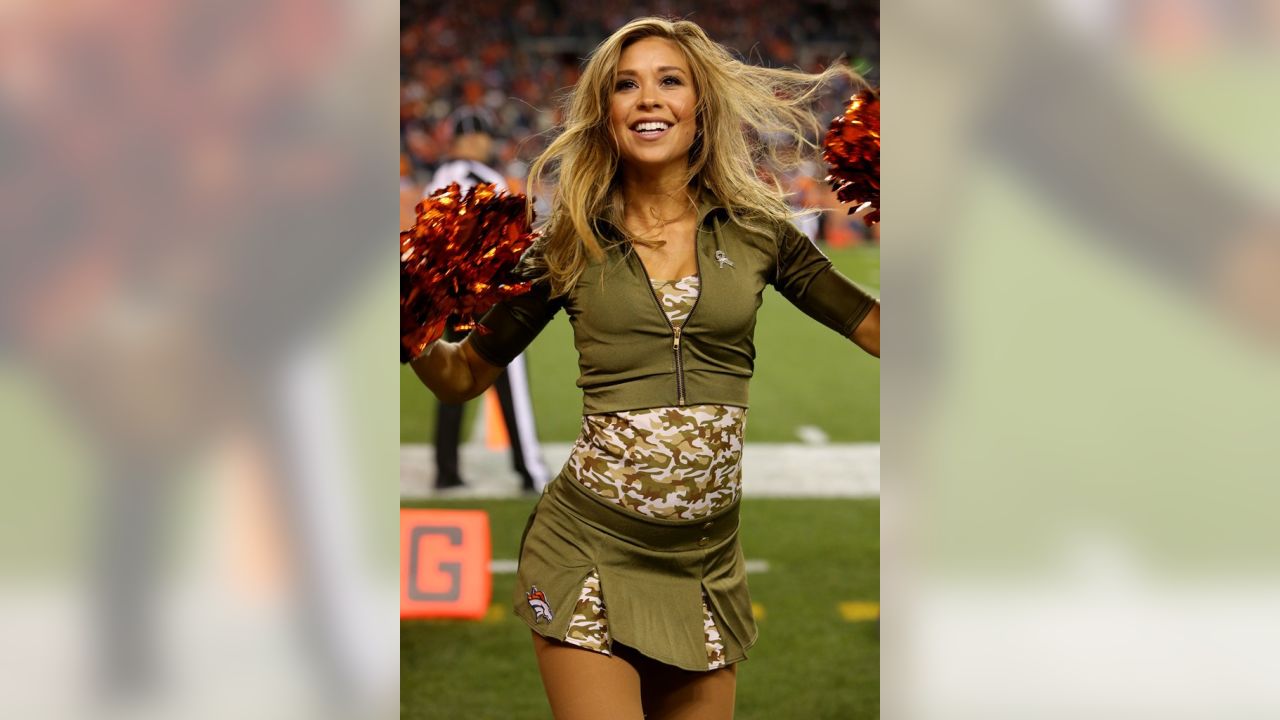 The Denver Broncos cheerleaders wear green to celebrate the NFL's Salute to  Service prior to an NFL football game against the New England Patriots,  Sunday, Nov. 12, 2017, in Denver. (AP Photo/David