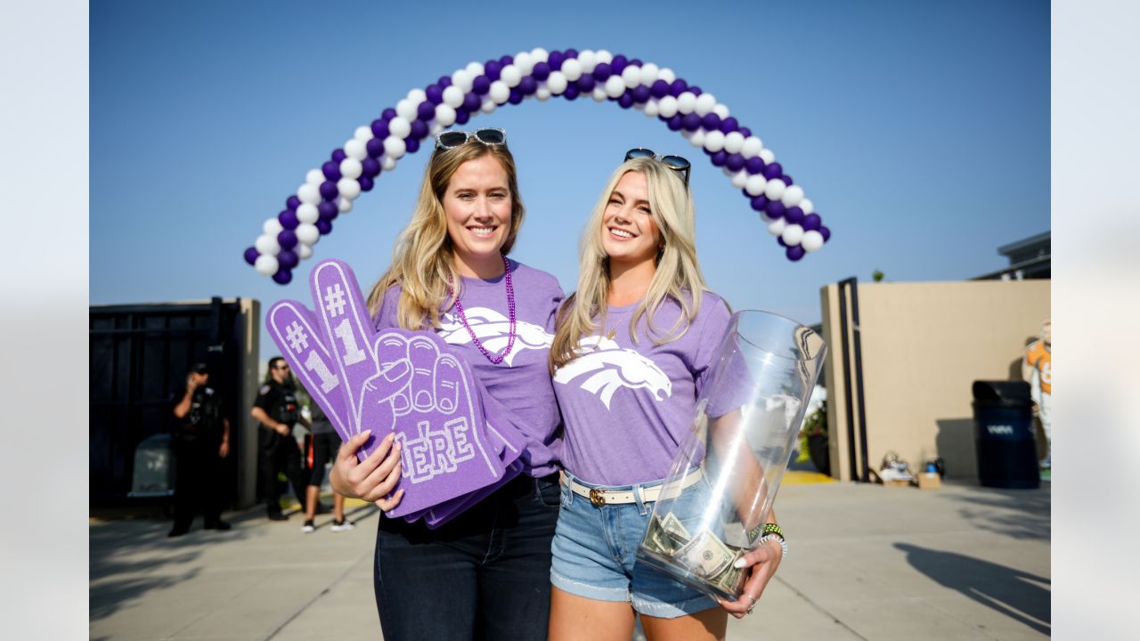 Brittany Bowlen, center, chats with George Paton, right, general manager of  the Denver Broncos, and Nancy Thompson during a news conference to raise  awareness of Alzheimer's disease outside the team's headquarters Wednesday