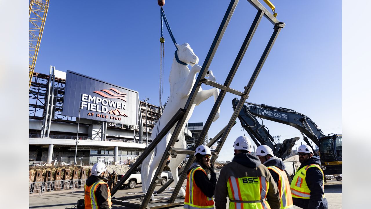 Last large section of the Mile High stadium during demolition : r