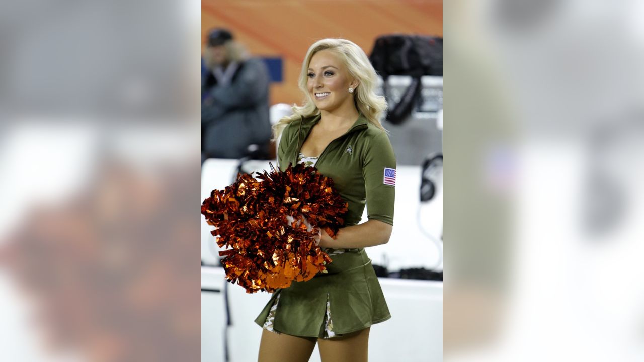 The Denver Broncos cheerleaders wear green to celebrate the NFL's