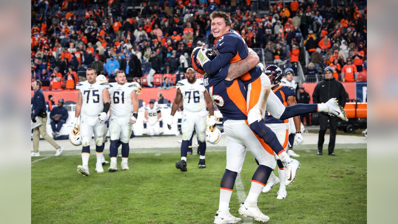 Denver, Colorado, USA. 8th Jan, 2023. Chargers WR MIKE WILLIAMS tries to  shake off a tackle by Broncos S JUSTIN SIMMONS during the 2nd. Half at  Empower Field at Mile High Sunday