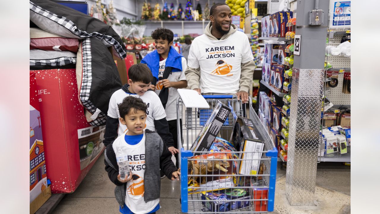 Kids go on a shopping spree with Denver Broncos players