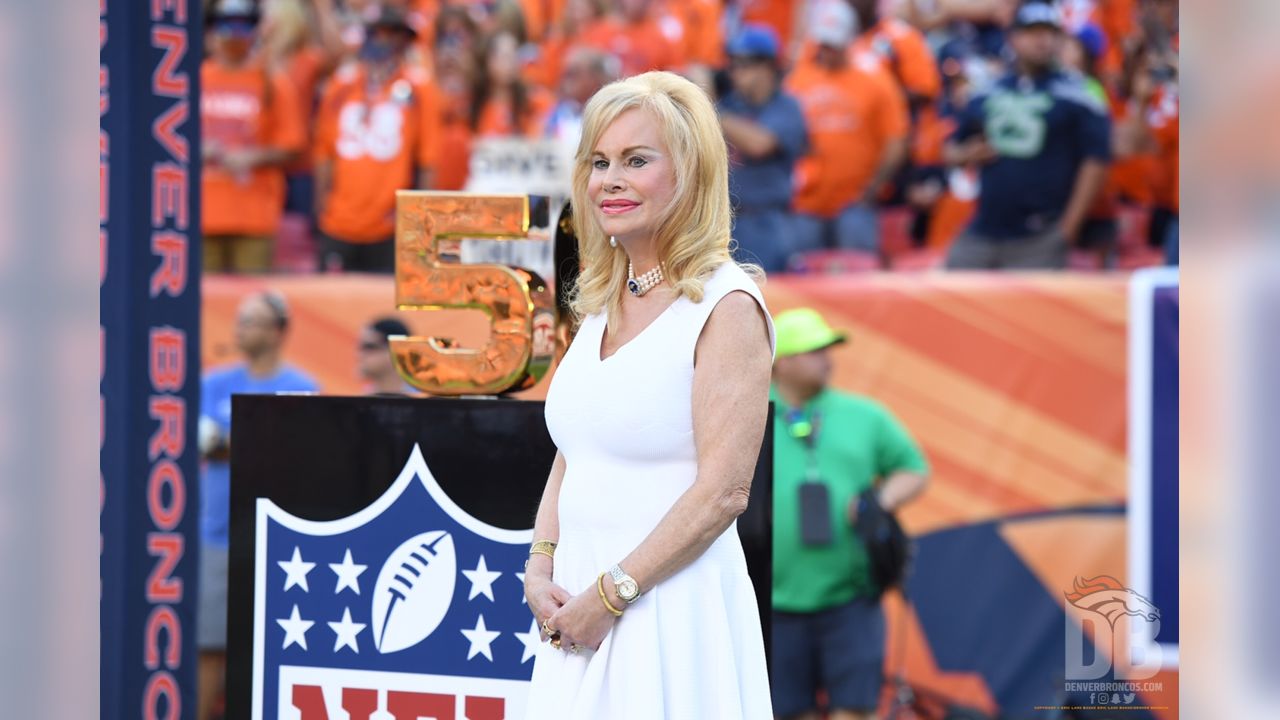 John Bowlen, left, and his mother, Annabelle, the wife of Denver Broncos  owner Pat Bowlen, acknowledge the crowd at a rally following a parade  through downtown Tuesday, Feb. 9, 2016 in Denver.