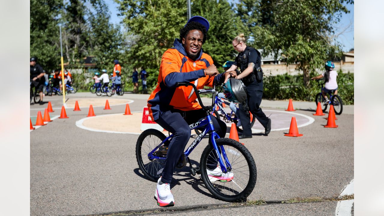 Broncos' Lloyd Cushenberry helps gift 29 bikes to Wyatt Academy fifth  graders