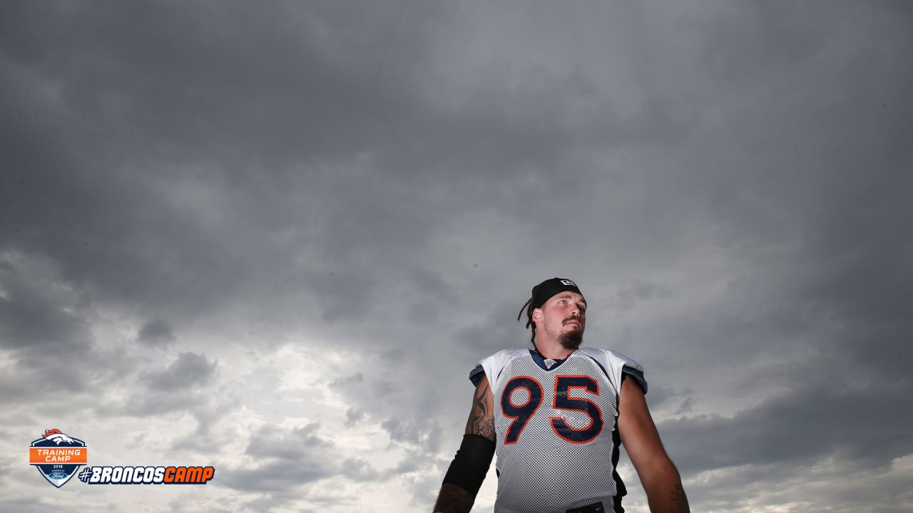 Denver Broncos nose tackle Domata Peko (94) calls for crowd