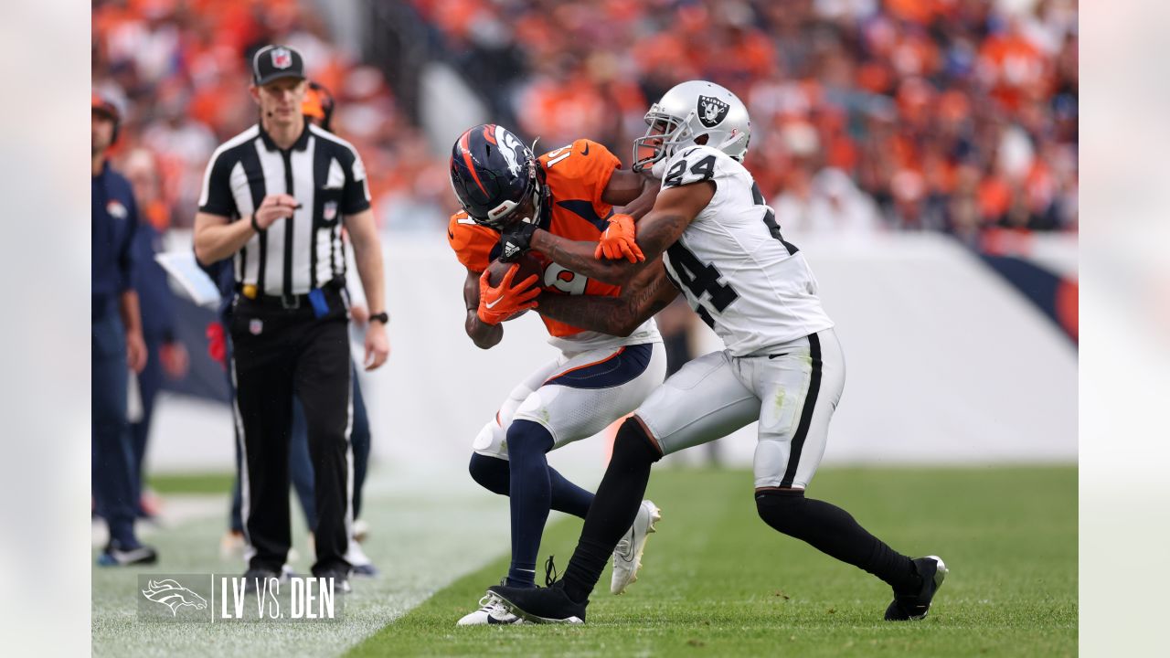 Denver Broncos vs. Las Vegas Raiders. NFL Game. American Football League  match. Silhouette of professional player celebrate touch down. Screen in  back Stock Photo - Alamy