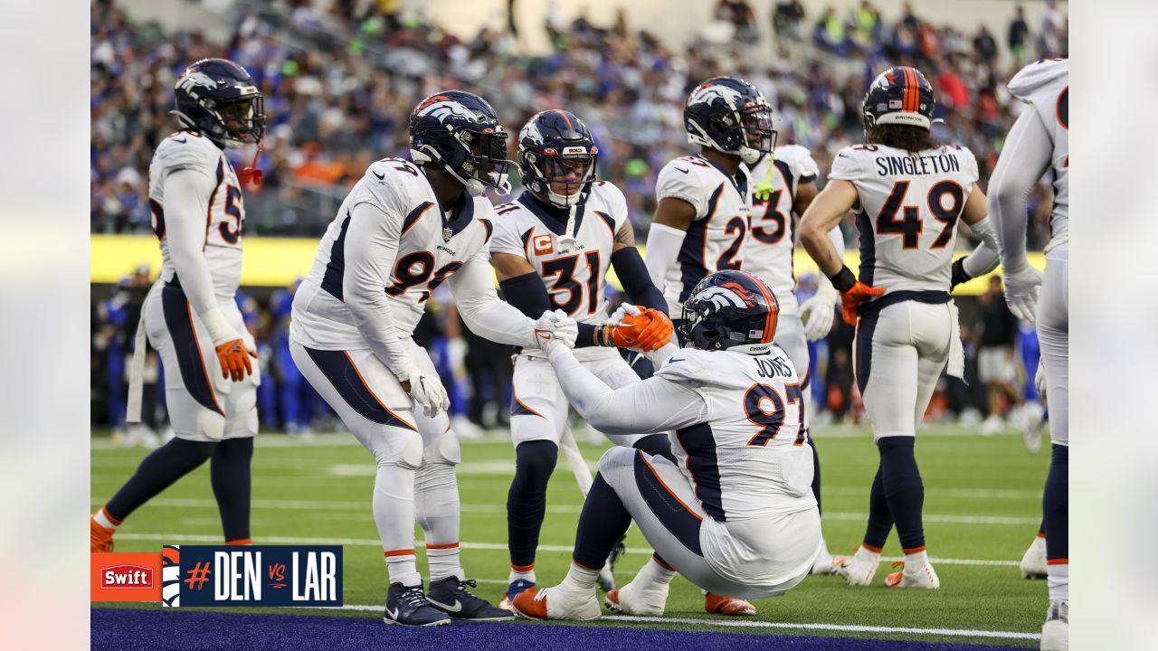 A Denver Broncos Christmas tree is set up as fans tailgate prior to an NFL  football game against the Cincinnati Bengals, Sunday, Dec. 19, 2021, in  Denver. (AP Photo/David Zalubowski Stock Photo 