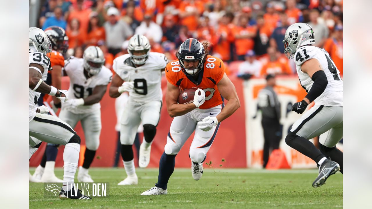 Denver Broncos vs. Las Vegas Raiders. NFL Game. American Football League  match. Silhouette of professional player celebrate touch down. Screen in  back Stock Photo - Alamy