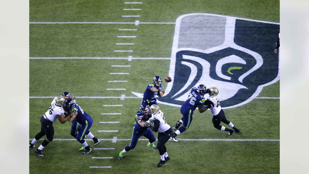 San Francisco 49ers Mike McGlinchey (69) walks on the field with a shirt  displaying Crucial Catch during an NFL football game against the Seattle  Seahawks, Sunday, October 3, 2021, in Santa Clara