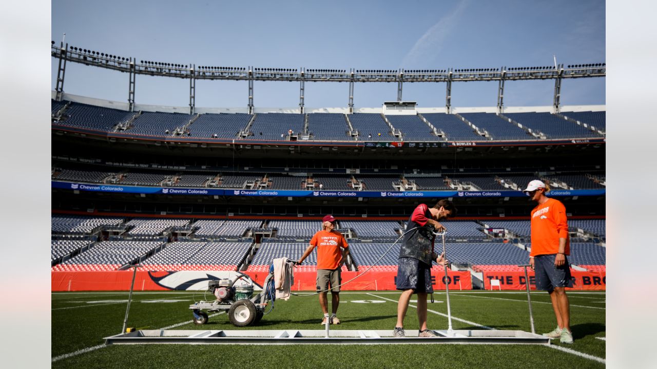 Painting a Broncos Hall of Fame wall at the Empower Field on the Team store.  : r/DenverBroncos