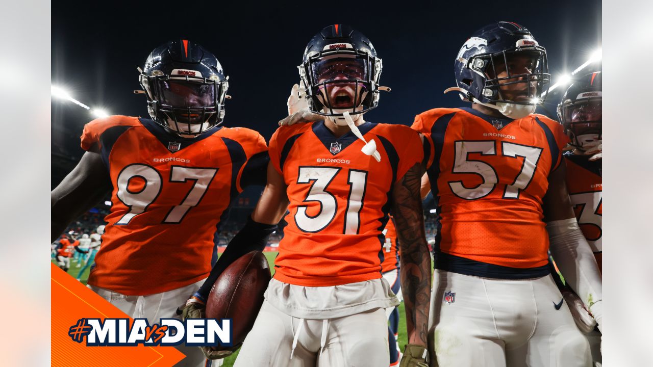 Justin Simmons of the Denver Broncos signals for fourth down during News  Photo - Getty Images