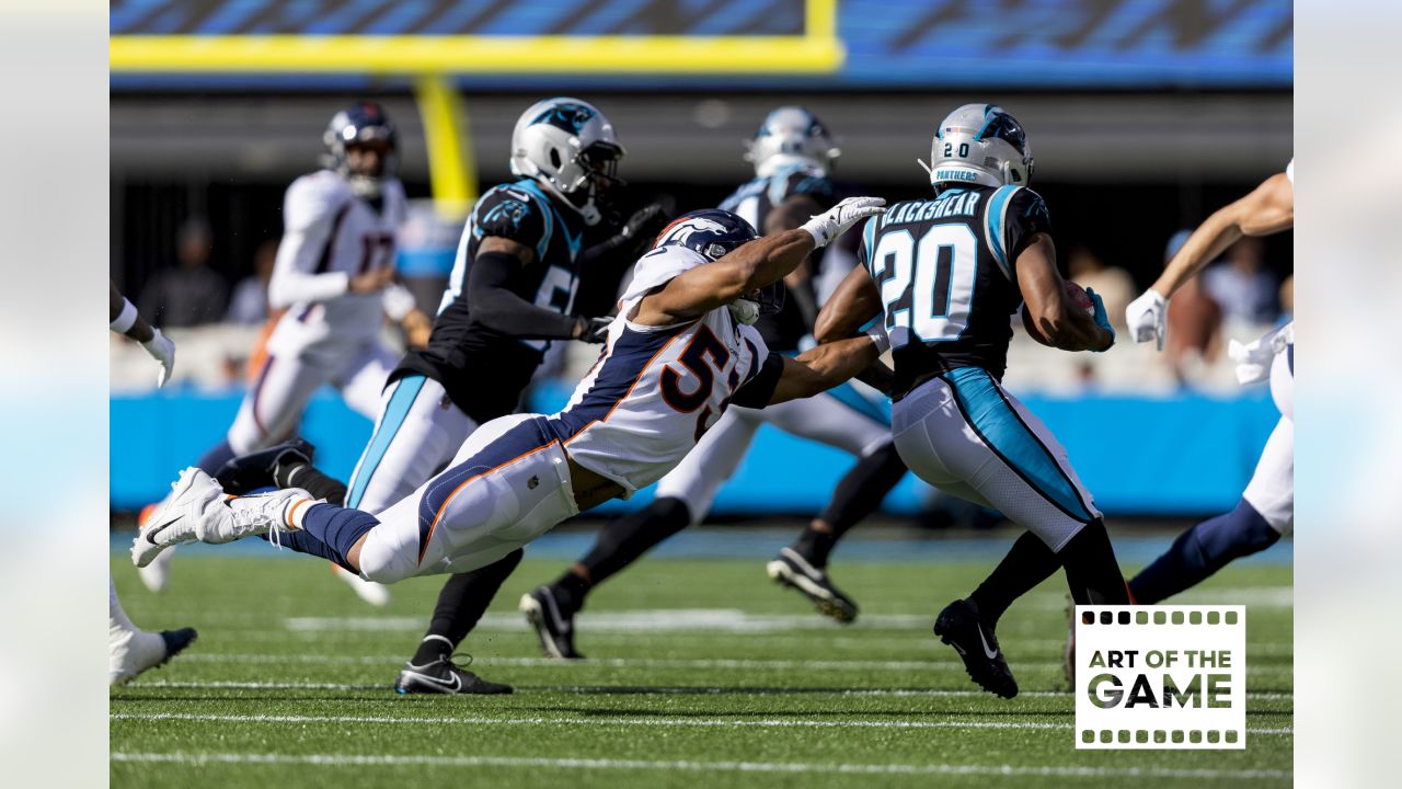 Carolina Panthers running back D'Onta Foreman (33) makes a run against  Denver Broncos cornerback Damarri