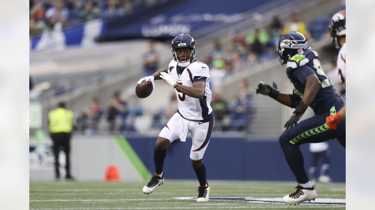 Denver Broncos' Shaun Beyer smiles while on the bench against the Seattle  Seahawks during the second half of an NFL football preseason game,  Saturday, Aug. 21, 2021, in Seattle. The Broncos won