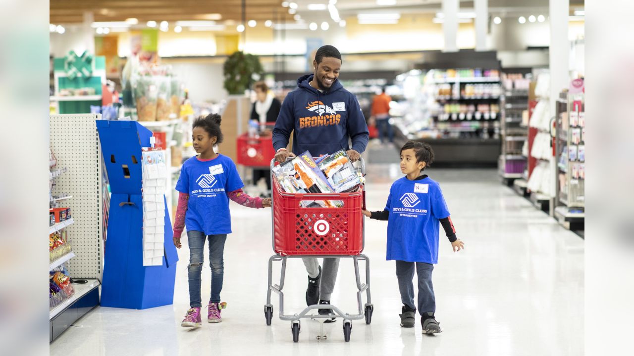 Kids go on a shopping spree with Denver Broncos players