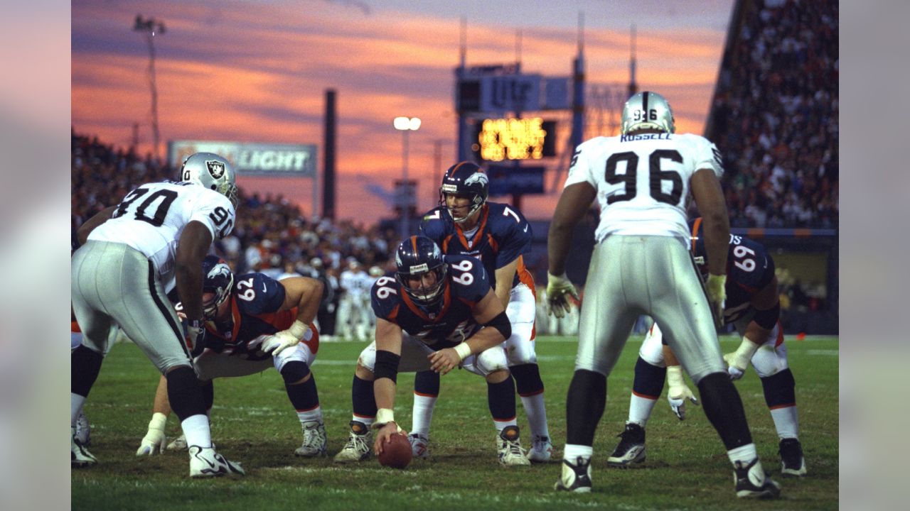 Wearing a throwback New York Titans uniform, New York Jets quarterback Brett  Favre drops back for a pass during pregame warmups before the Jets faced  the Cincinnati Bengals in their NFL football