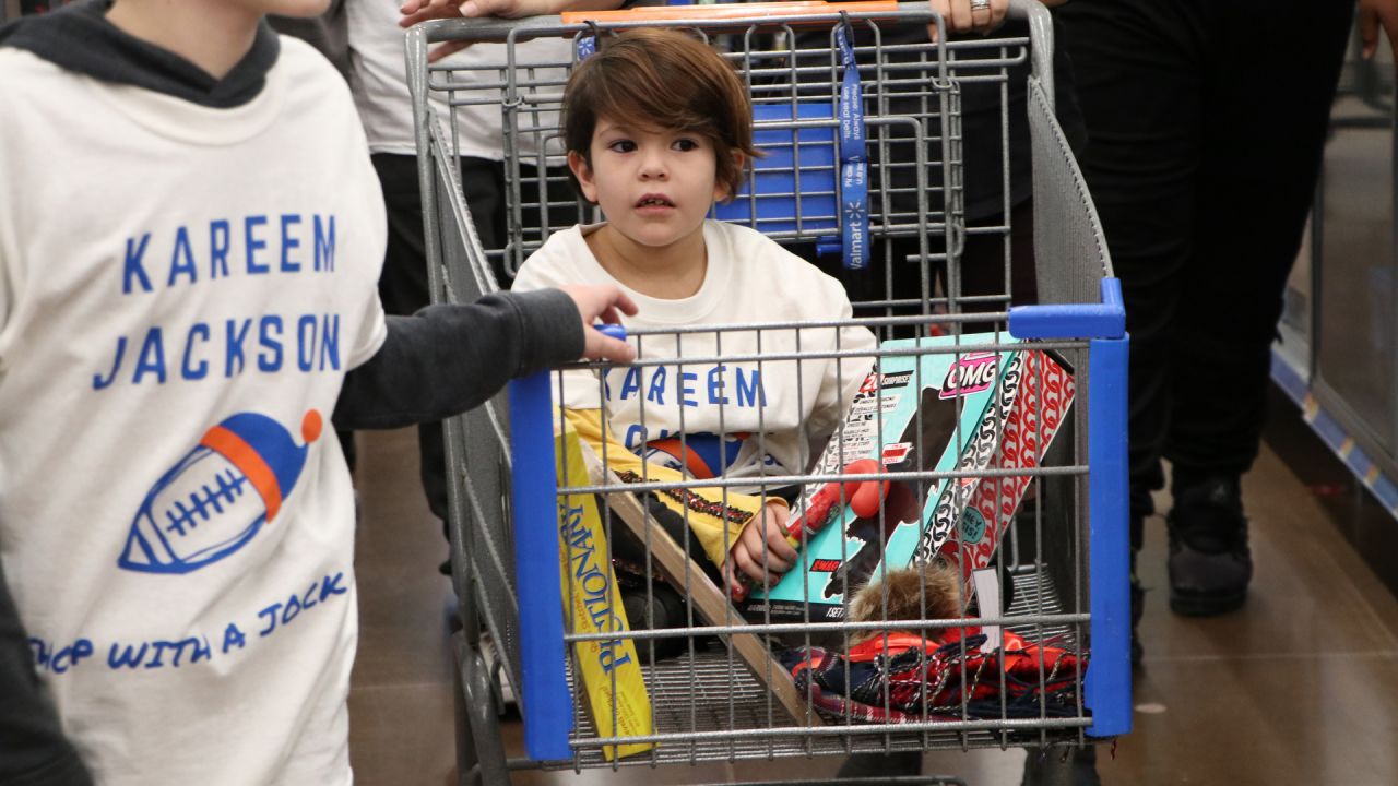 Kids go on a shopping spree with Denver Broncos players