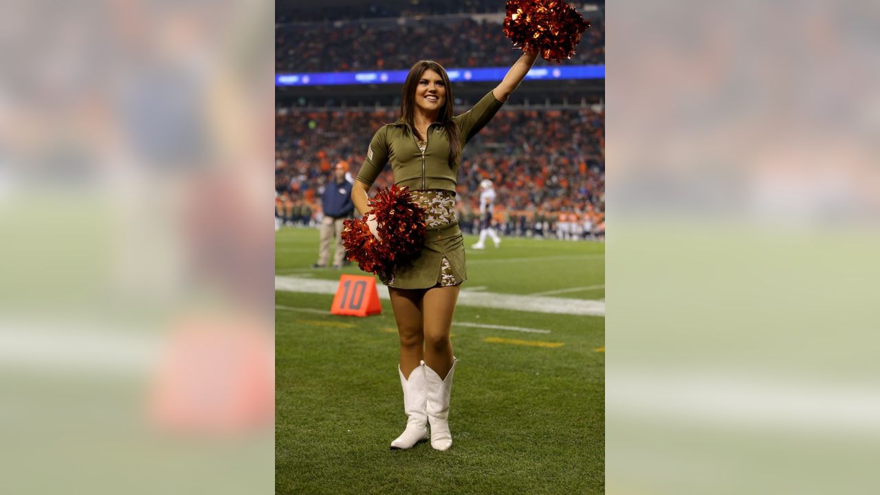 The Denver Broncos cheerleaders wear green to celebrate the NFL's Salute to  Service prior to an NFL football game against the New England Patriots,  Sunday, Nov. 12, 2017, in Denver. (AP Photo/David