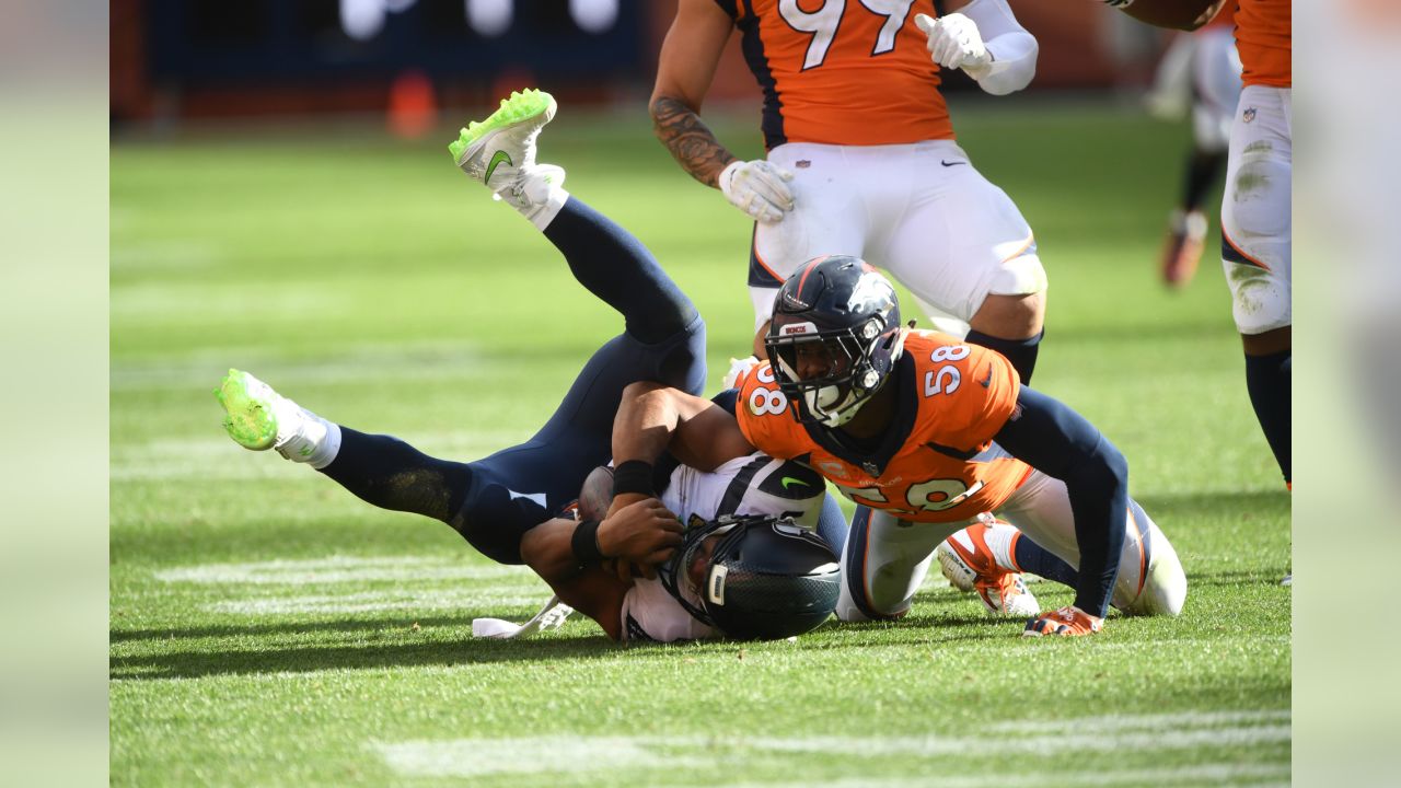 Denver Broncos linebacker Von Miller (58) and linebacker Alexander Johnson  (45) follow a play during the first half of an NFL football game against  the Jacksonville Jaguars, Sunday, Sept. 19, 2021, in