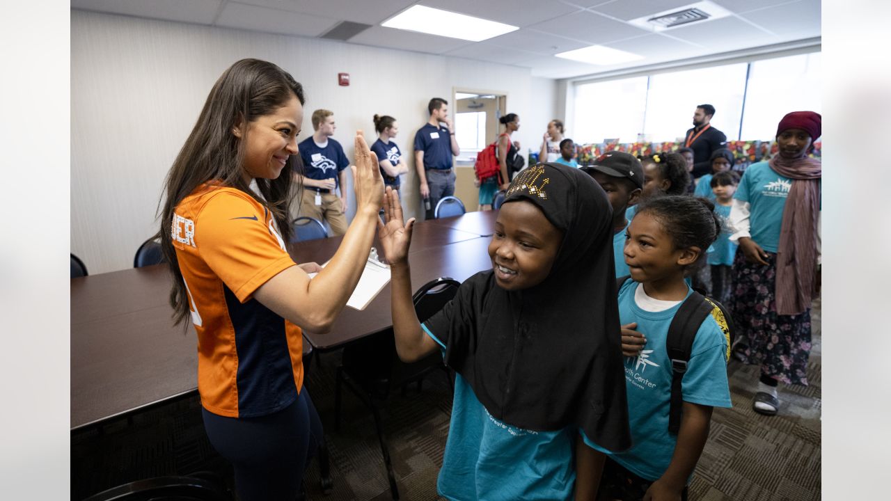 Kids go on a shopping spree with Denver Broncos players