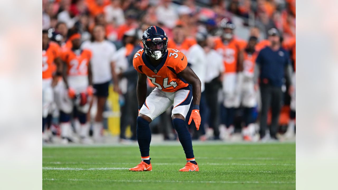 Denver Broncos wide receiver Jalen Virgil (15) warms up before an