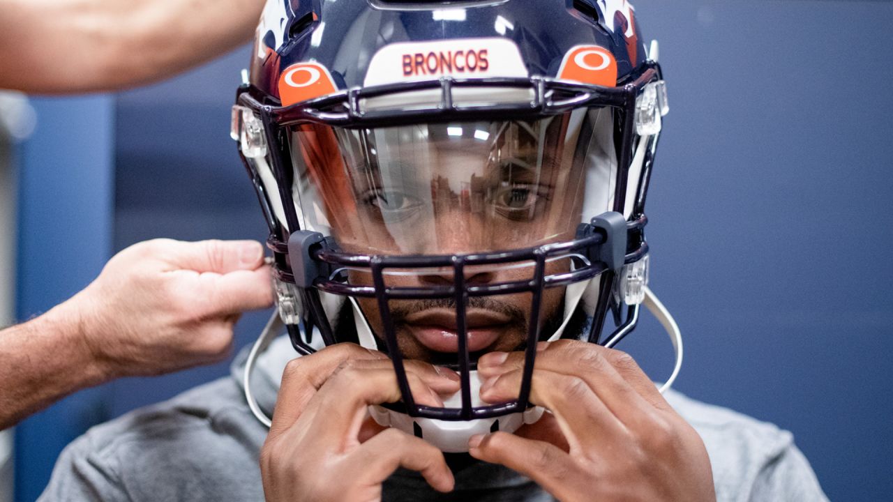 Denver Broncos' Shaun Beyer smiles while on the bench against the