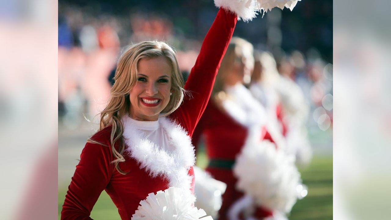 The Denver Broncos cheerleaders perform in Christmas costumes